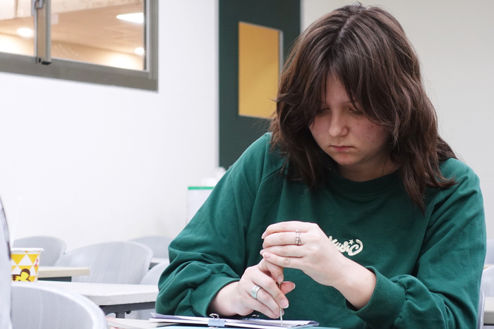 The international student was making her traditional book binding.